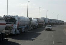 Trucks carrying aid enter Gaza, efforts to release hostages